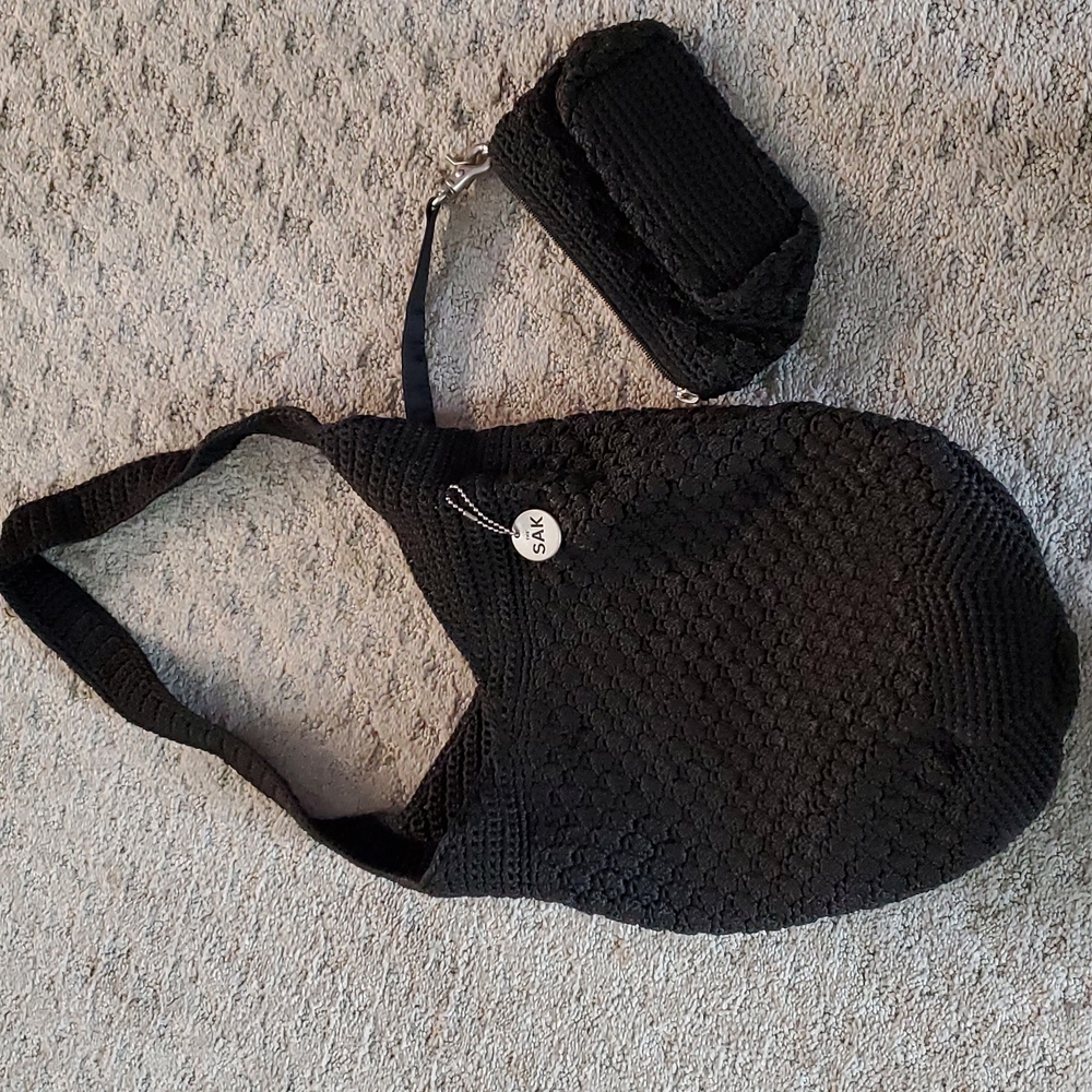 The sak snap closure purse. Black knit. 11 x 11 and 11 inch drop. Not used.